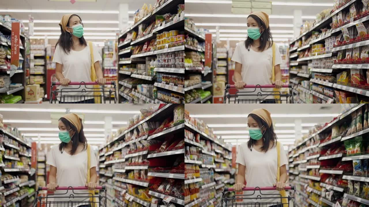 在杂货店戴医用口罩的亚洲女性。