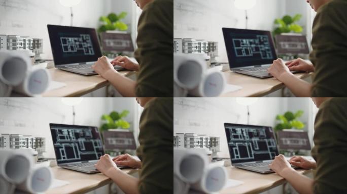 在笔记本电脑上工作的建筑师