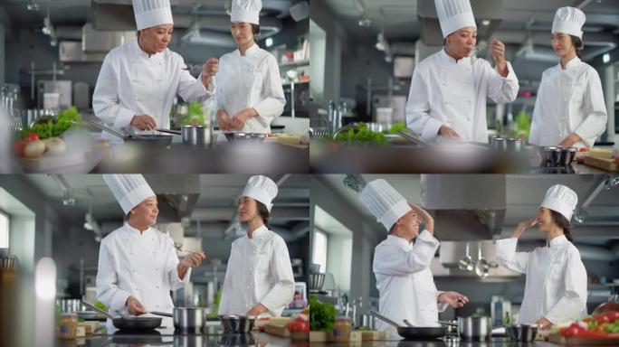 餐厅厨房: 亚洲和黑人女厨师准备菜肴，品尝食物并在成功的庆祝活动中击掌。两位专业烹饪美味、正宗食物、