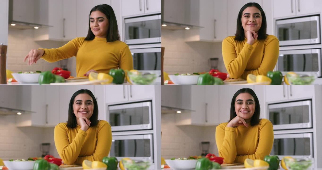 4k视频片段，一名年轻女子在家做健康的饭菜