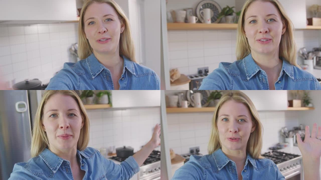 女人在社交媒体上拍摄关于厨房里家里食物的视频
