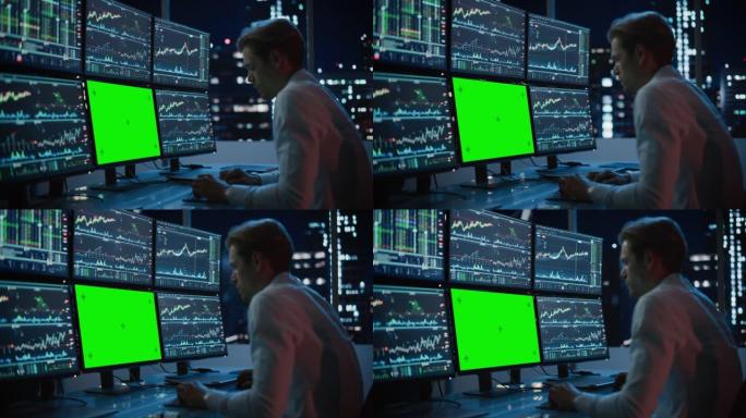 财务分析师在计算机上工作，该计算机具有带有绿屏色度键模拟模板和实时股票图表的多显示器工作站。商人晚上