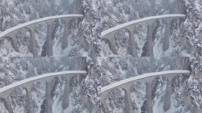 空中Landwasser高架桥冰川和Bernina快车，冬季下雪。