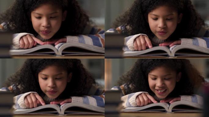 一个年轻女孩独自坐在家里看教科书的4k视频片段
