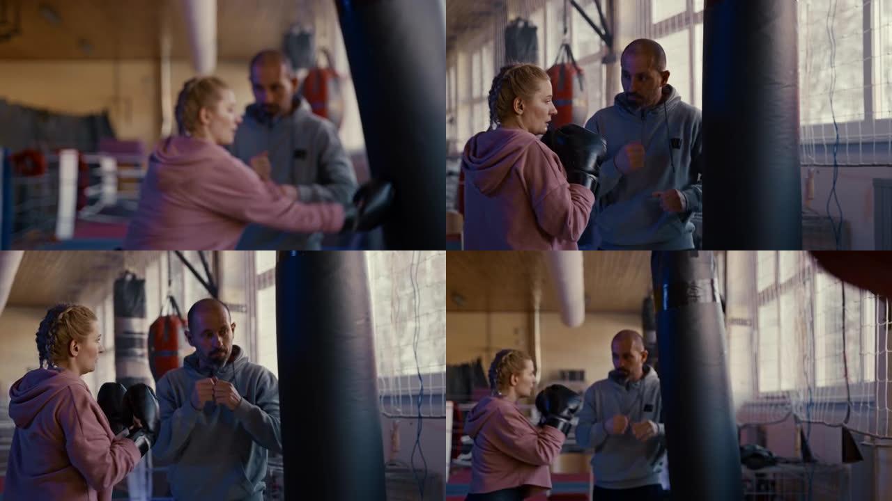 慢动作拳击教练教授女拳击手不同的打孔技术