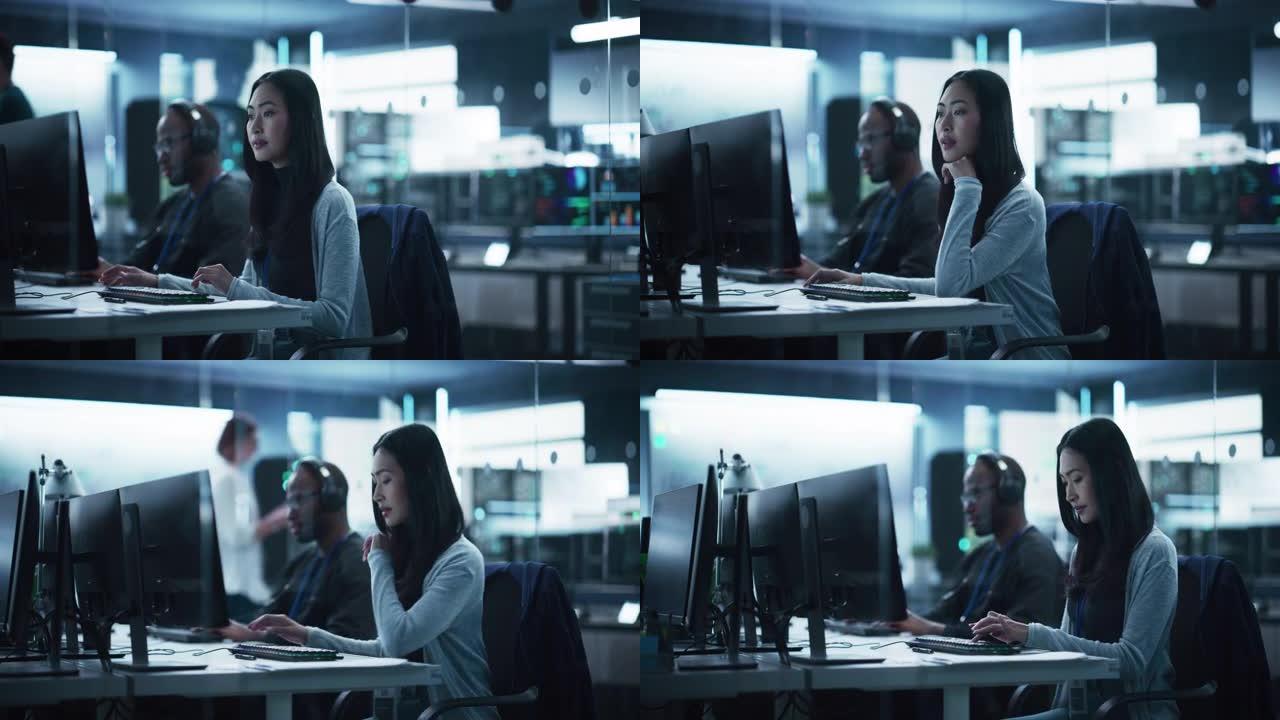 美丽的年轻亚洲女性专家与专业同事一起在计算机上工作。具有服务器设施、存储硬件和企业科学氛围的数据保护