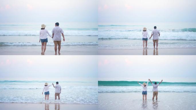 情侣喜欢漫步在沙滩上快乐