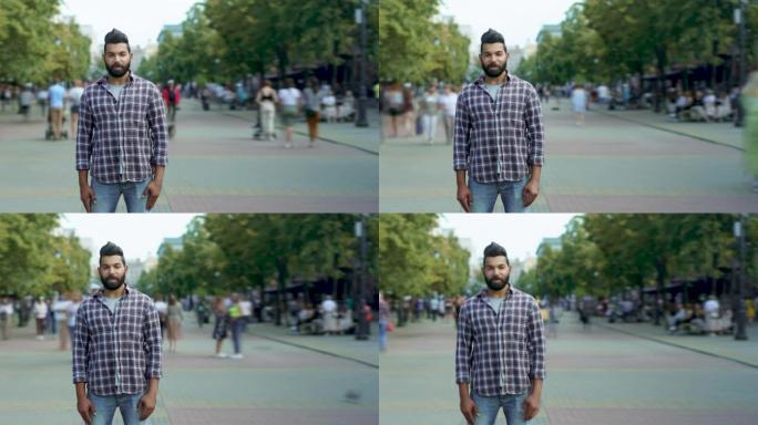 自信的阿拉伯男子站在繁忙的街道上，年轻人四处走动的时间流逝肖像