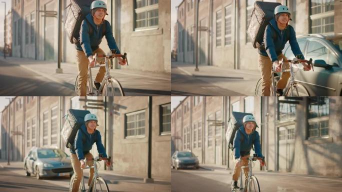 快乐的食品配送快递员穿着保暖背包骑着自行车在路上为客户和客户交付订单。现代市区的晴天。慢动作正面拍摄