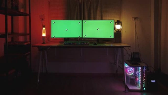 舒适的家庭办公室配有绿屏显示的现代个人电脑。