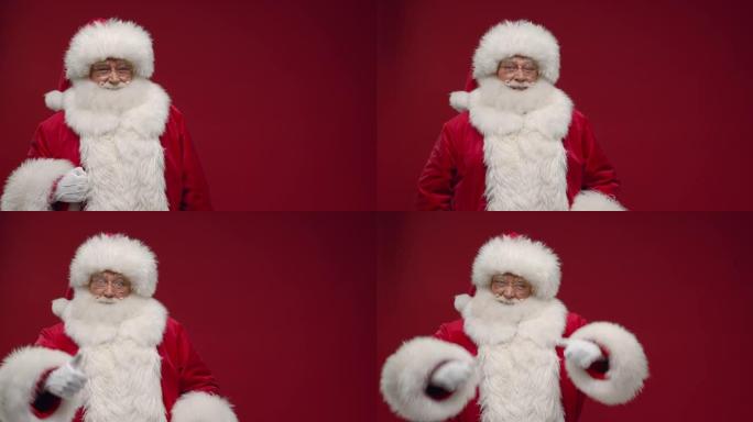 圣诞老人站在红色背景上，右边是复制空间，竖起大拇指