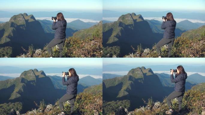 女人在山顶上拍照山顶记录