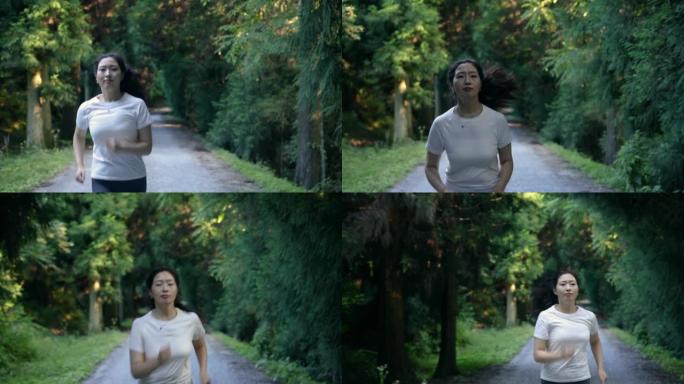 在森林小径上奔跑的妇女