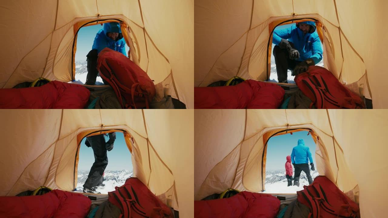 登山者喝酒雪山上露营喝酒取暖