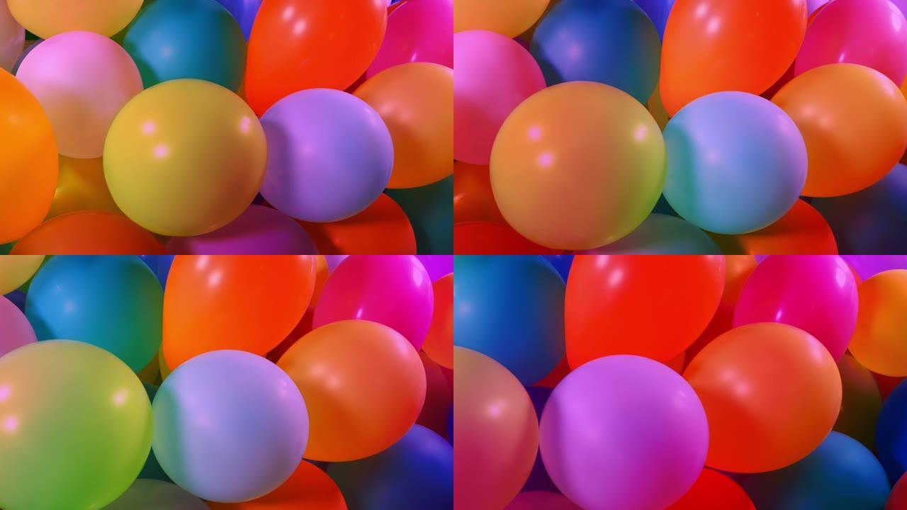 派对现场许多气球在五颜六色的灯光下
