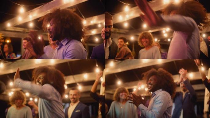 美丽的无忧无虑的朋友们的特写镜头正在一起跳舞，并在聚会上庆祝晚间活动。多元化的多民族年轻人在餐厅的公