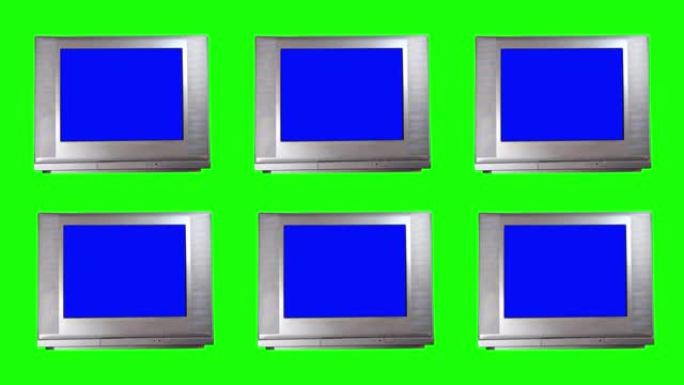 绿色背景上蓝屏的复古电视。