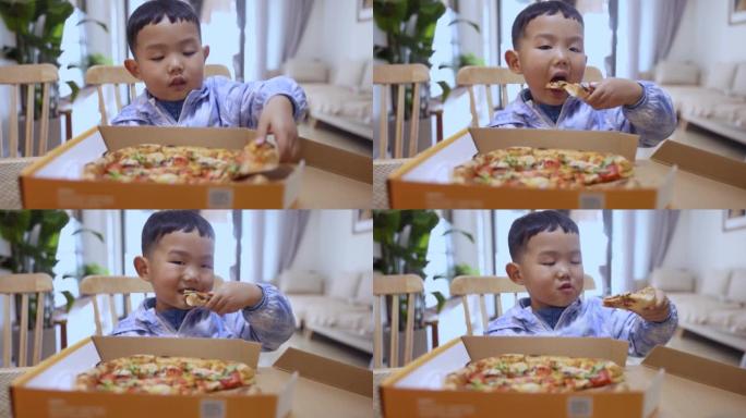 吃披萨的亚洲男孩吃披萨的亚洲男孩美食