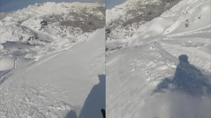 自由式滑雪板运动员穿越积雪的垂直视频POV拍摄
