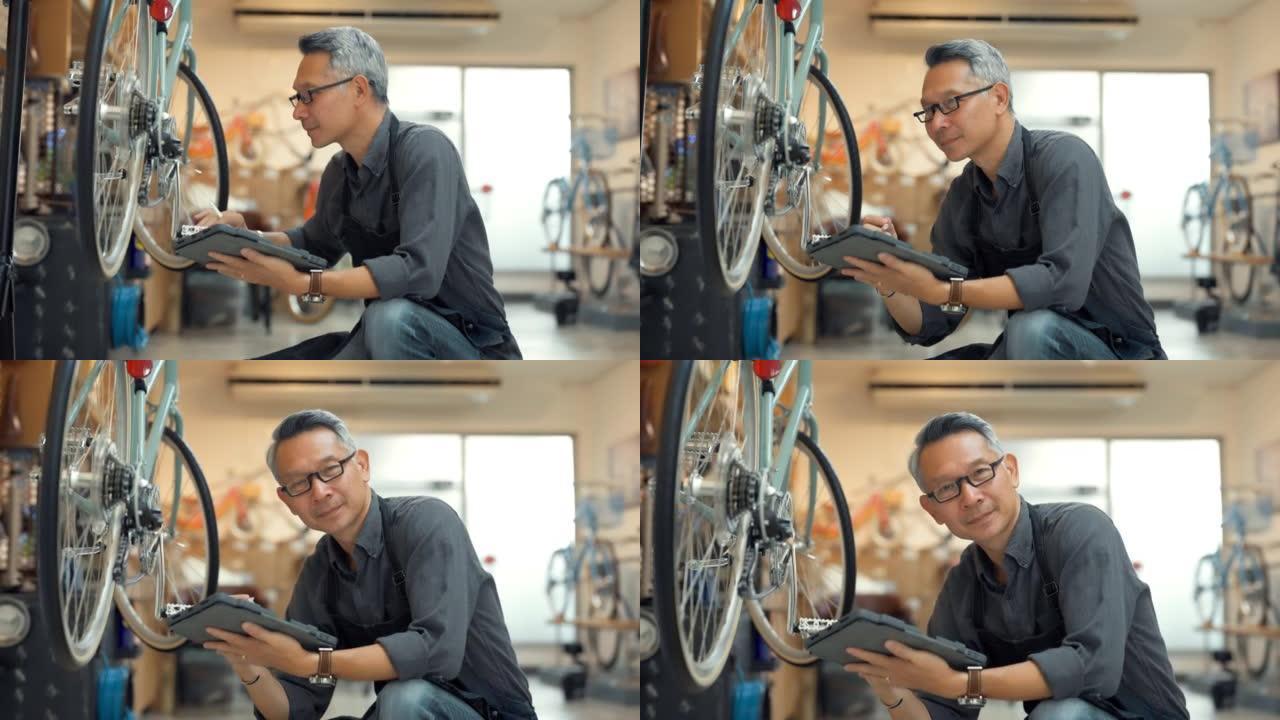 亚洲高级车主修理自行车的肖像。