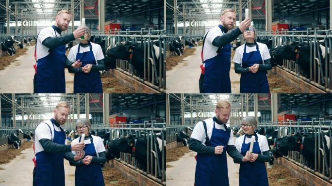 一名农场工人正在向他的同事展示牛奶样品