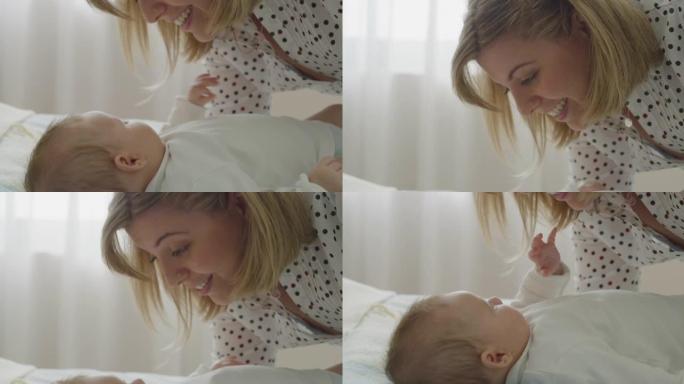 年轻的neo母亲的电影特写镜头在早晨与刚出生的婴儿在托儿所里玩耍。儿童，婴儿，父母身份，童年，生活，