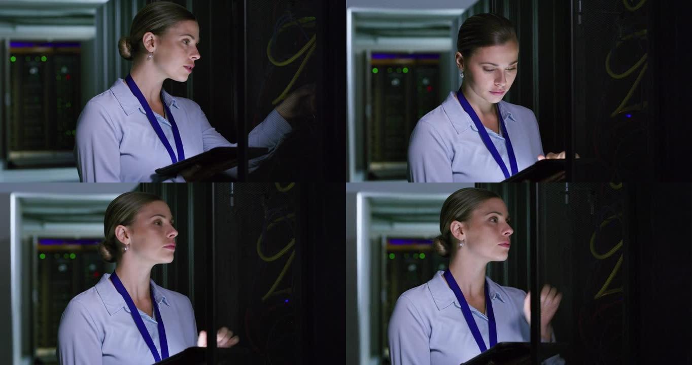 一名年轻女子在服务器机房工作时使用数字平板电脑的4k视频片段