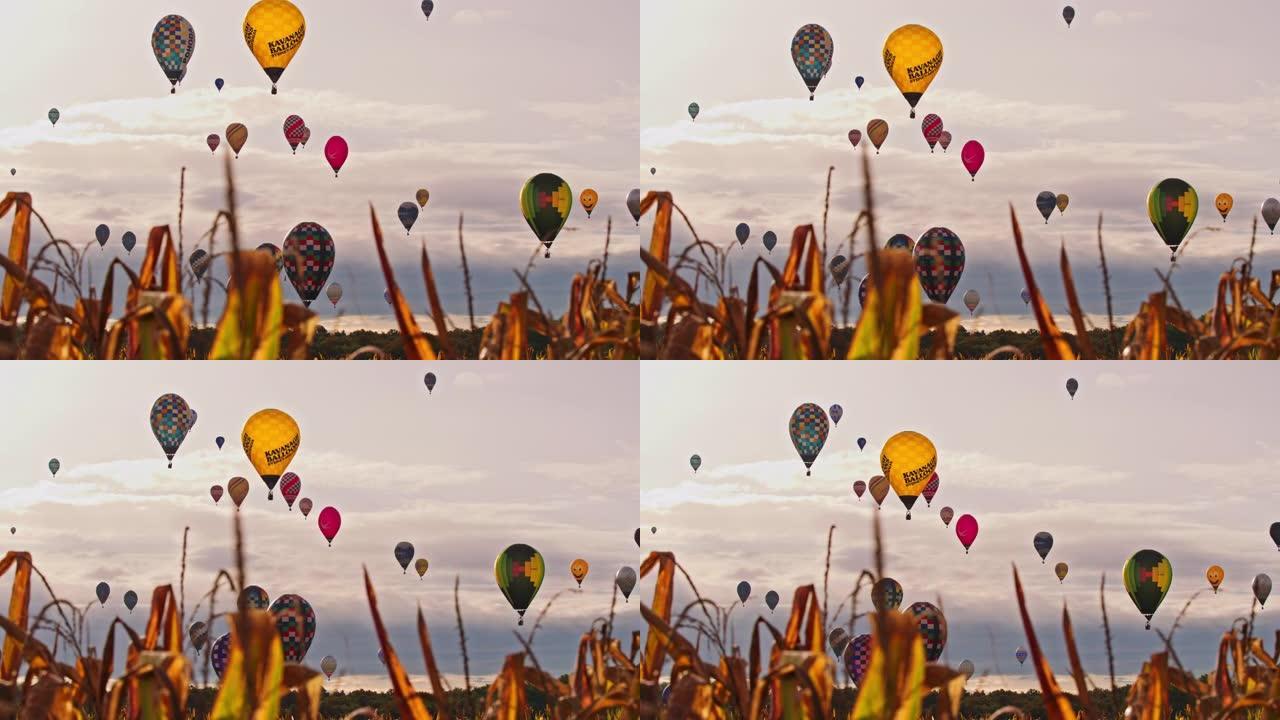 充满活力的热气球漂浮在多云宁静的天空中