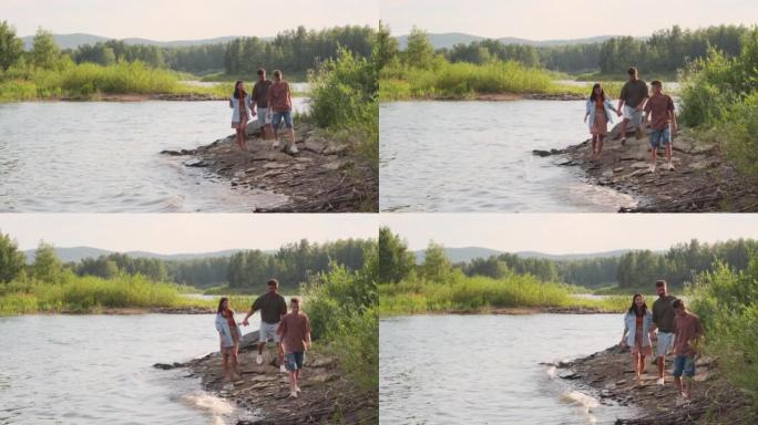 在湖岸散步的家庭一家人父子幸福
