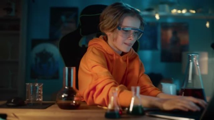 戴安全护目镜的聪明小男孩在烧杯中混合化学物质，并在笔记本电脑上写下结果。青少年进行教育科学爱好实验，