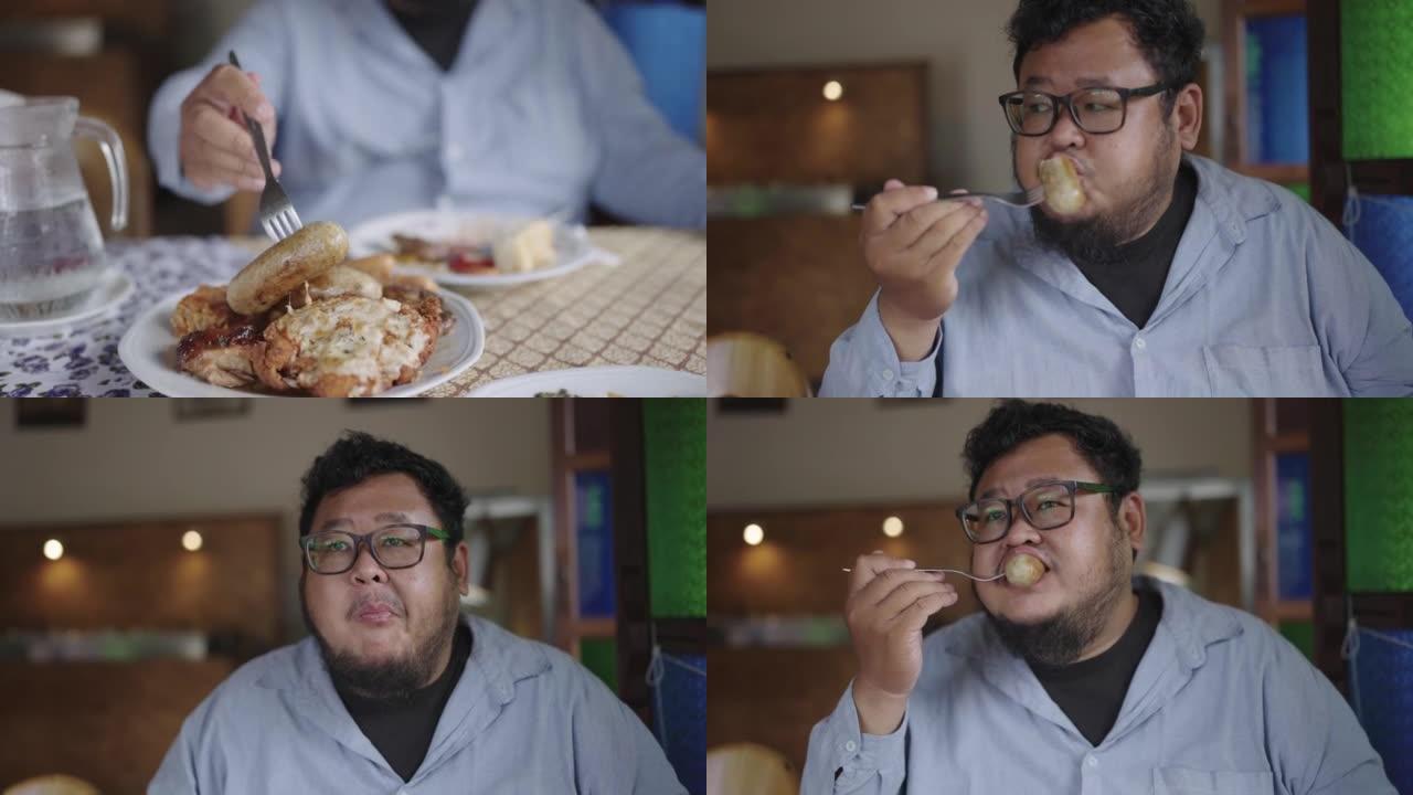 SLO MO: 胖乎乎的男人从盘子里分叉一根德国香肠，一边吃自助餐一边饿着吃。