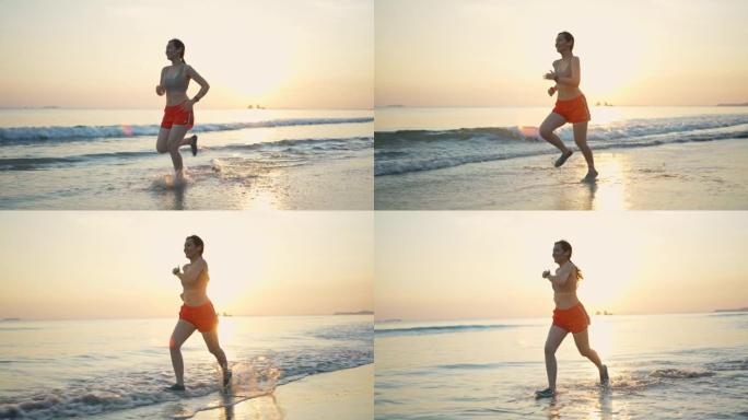 慢动作运动女子在沙滩上跑步