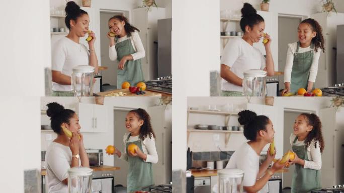 母亲，女孩，在家里玩水果，香蕉和跳舞，玩得开心，玩得开心。爱，关怀和喜剧，有趣而快乐的妈妈与抱着橘子