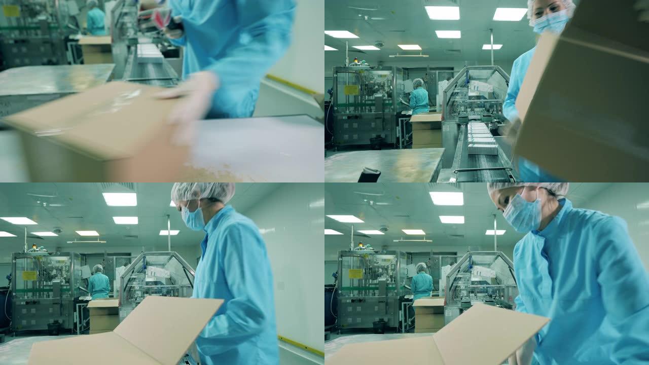 女药理学工作者正在使用胶带包装盒子
