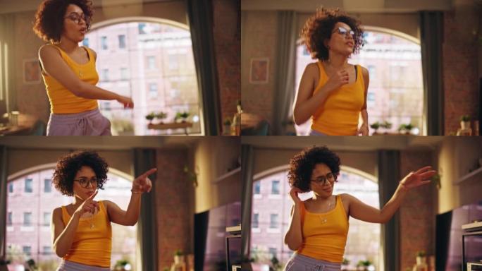 多民族年轻黑人女性穿着舒适的休闲服跳舞，在阁楼公寓里玩得开心的肖像。为社交媒体录制有趣的病毒视频。特