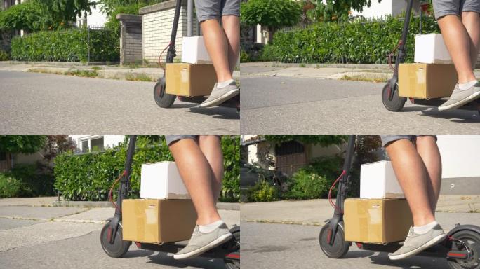 低角度: 无法识别的快递员在e-scooter上运送两个纸板箱。