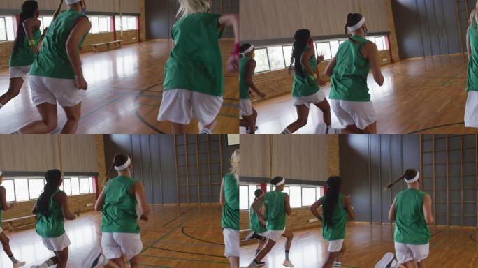 多样化的女子篮球队跑步，戴着口罩