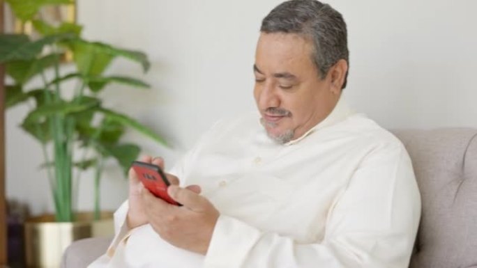 成熟的中东男人使用智能手机