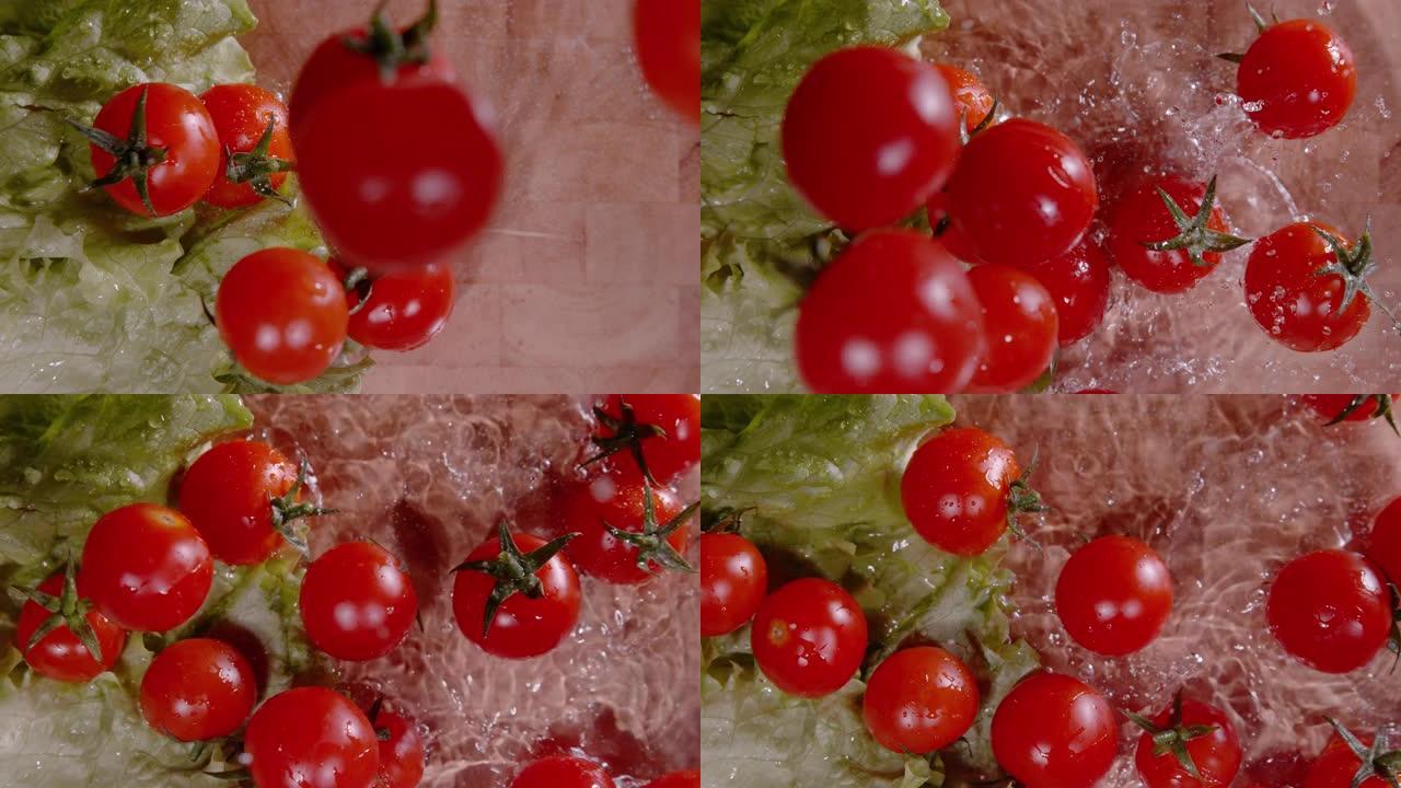 自上而下: 鲜红色的樱桃番茄掉到覆盖有水的切菜板上。