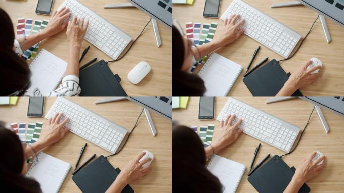 使用无线键盘打字在办公室与pc一起工作的女士手的特写慢动作