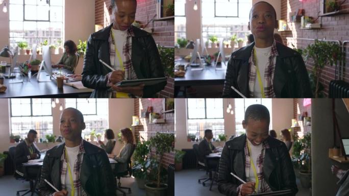 黑人妇女，快乐而自豪的平面设计师在办公室用手写笔和平板电脑进行技术项目规划。成功的业务团队负责人，领
