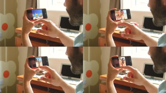 4k视频片段，一名男子在智能手机上浏览照片