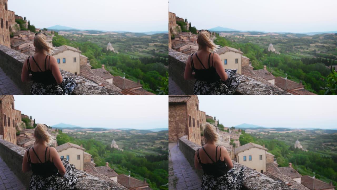 慢动作看一个金发女人看着风景，意大利。