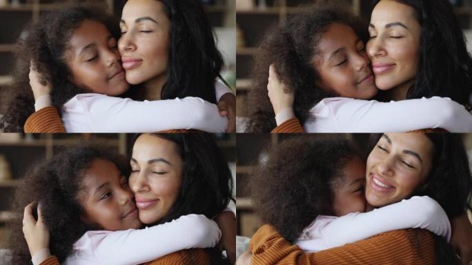 非洲爱心母亲的特写拥抱她的小女儿
