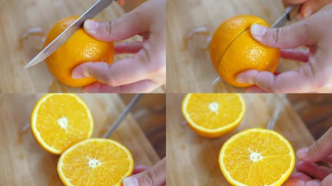 女人手工切片切割新鲜橙色水果