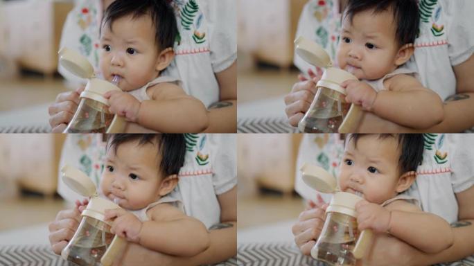 婴儿饮用水。展示小宝宝饮水喝水