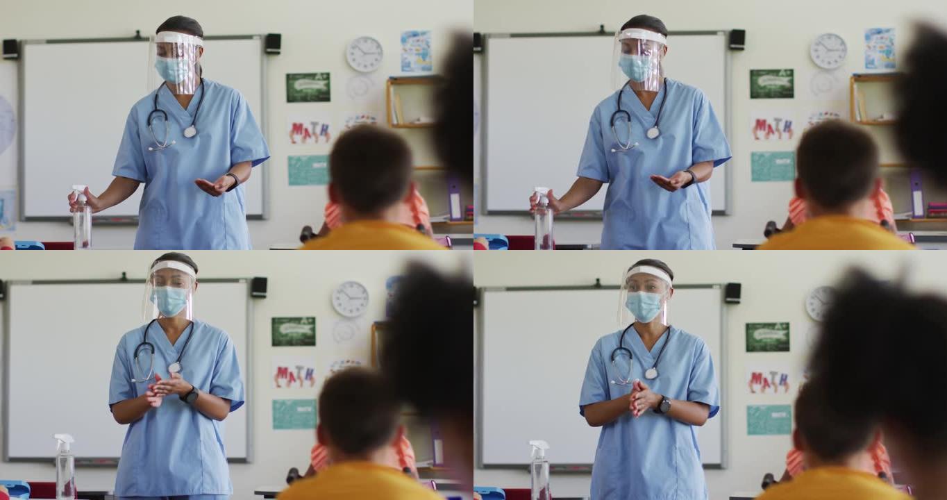 混血女医护人员戴口罩向学童展示如何消毒双手