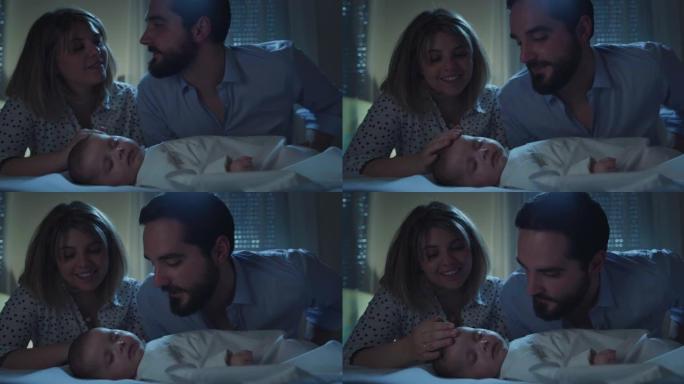 电影拍摄了幸福的家庭，新父母爱抚和亲吻他们刚出生的男婴，同时在晚上的托儿所里用柔软的毯子在婴儿床里安
