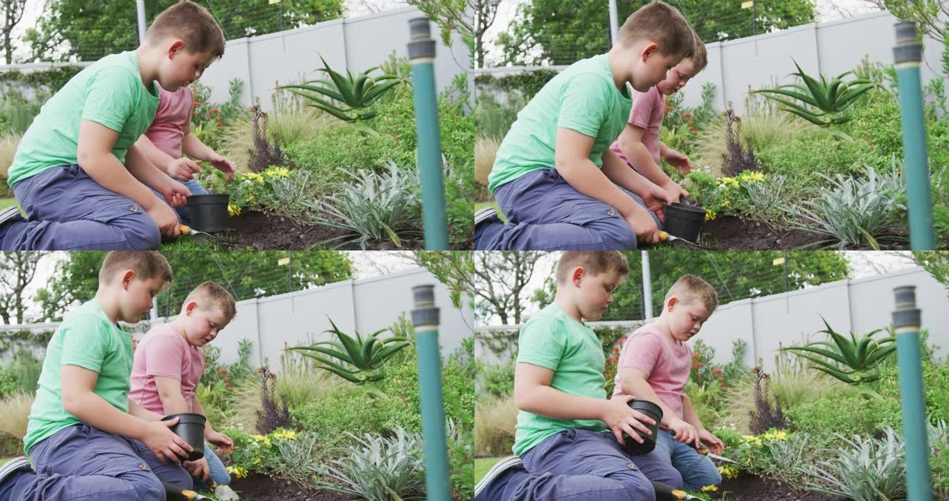 快乐的高加索男孩和他的兄弟一起在花园里园艺