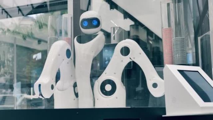 创新，现代技术理念。机器人在咖啡店里移动手臂